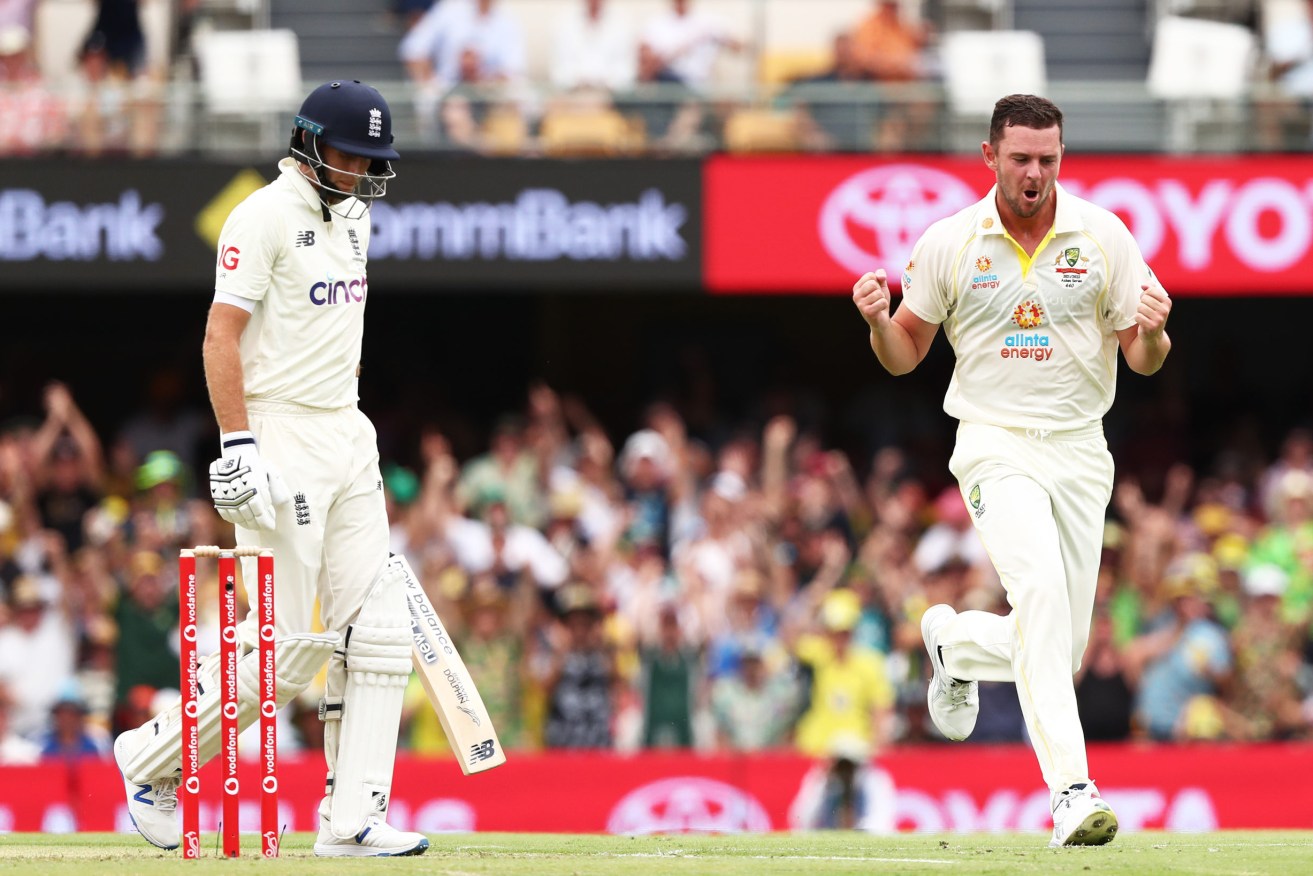 Australia's Josh Hazlewood celebrates the wicket of England captain Joe Root at The Gabba. Photo: Jason O'Brien/PA Wire