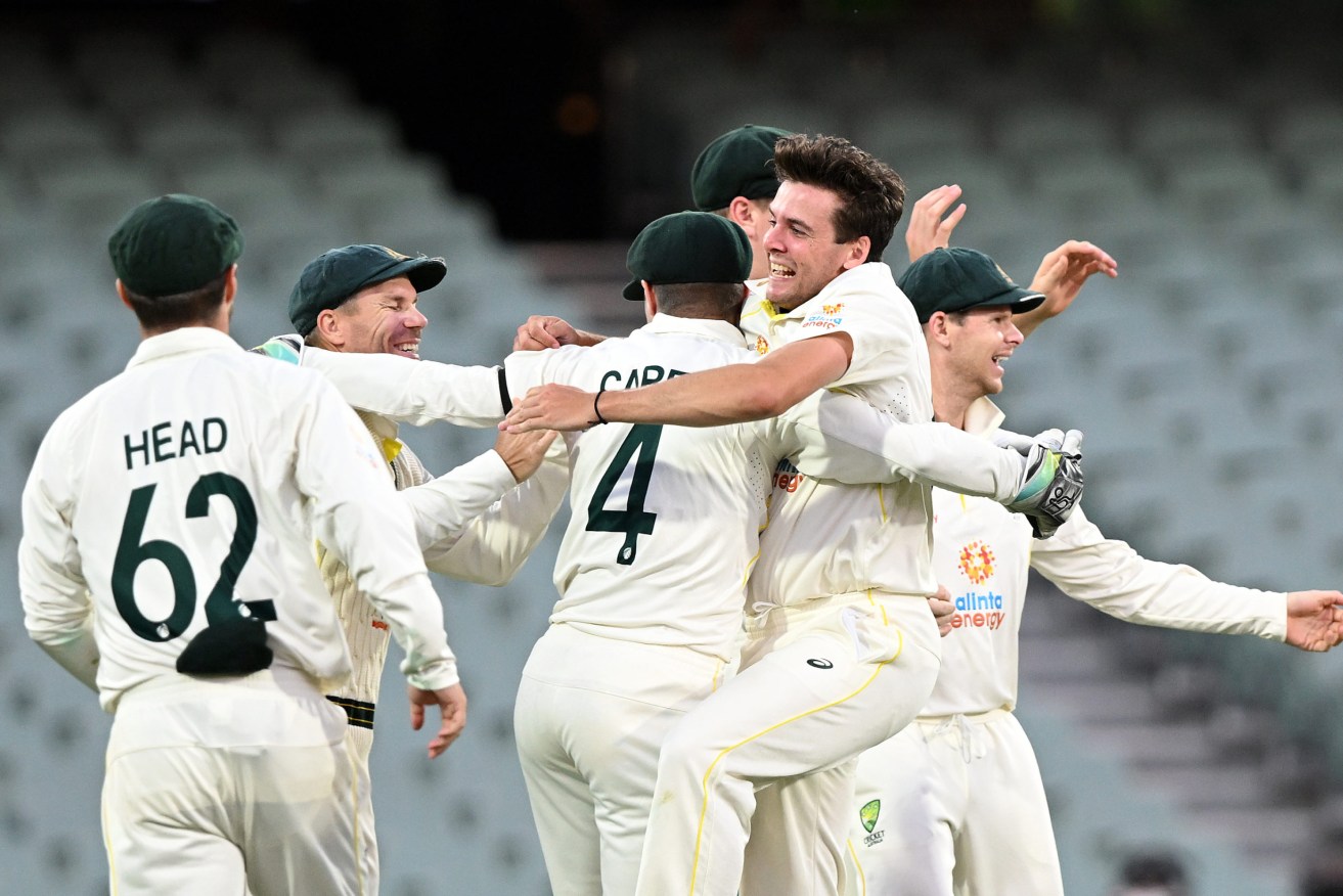 Australia celebrates the dismissal of England's  James Anderson during its Second Test win at Adelaide Oval. Photo: AAP/Dave Hunt
