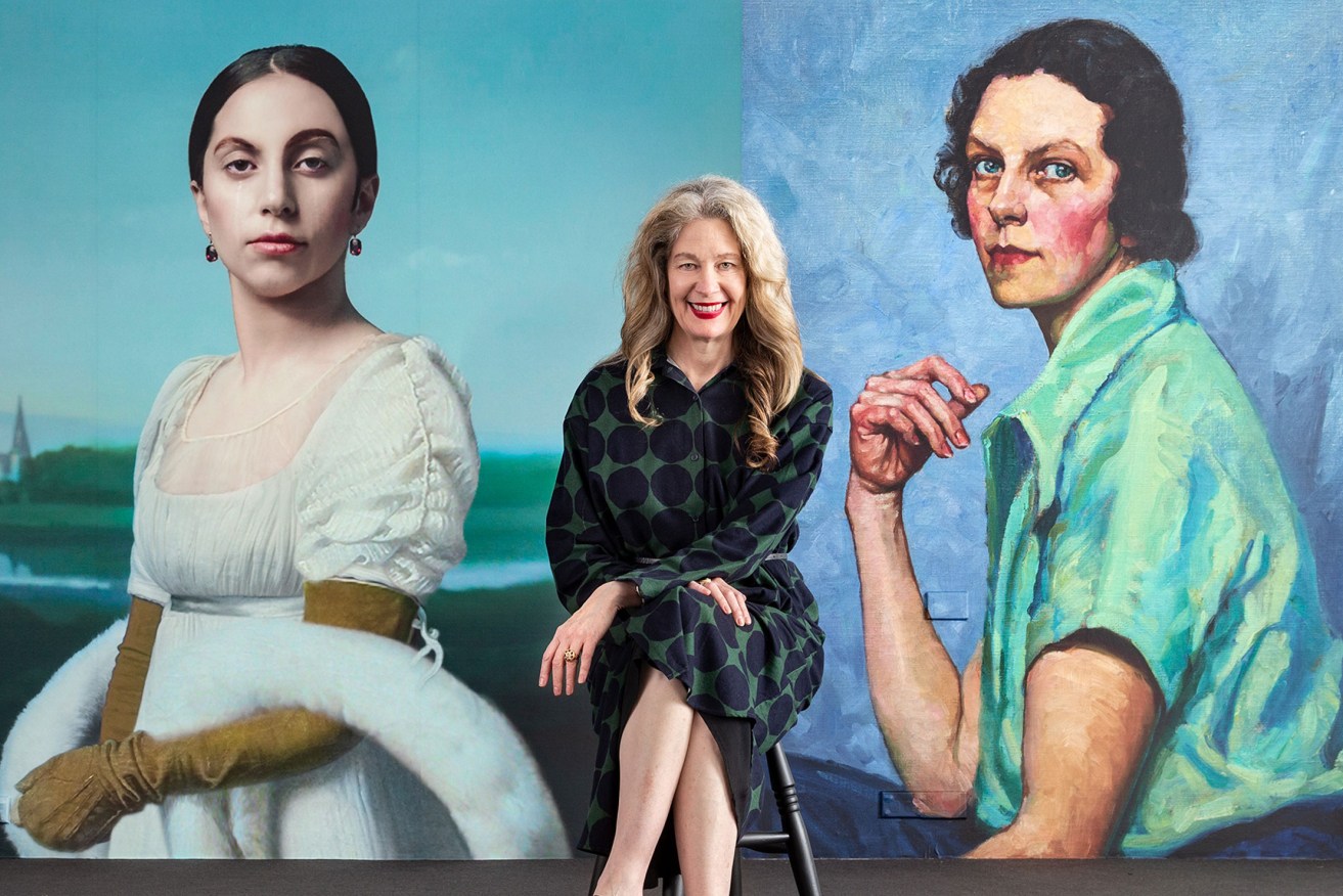 AGSA director Rhana Devenport in front of images of Robert Wilson's video portrait 'Lady Gaga: Mademoiselle Caroline Riviere', 2013, and Tempe Manning's 1939 self-portrait, which is part of the 'Archie 100' exhibition. Photo: Saul Steed
