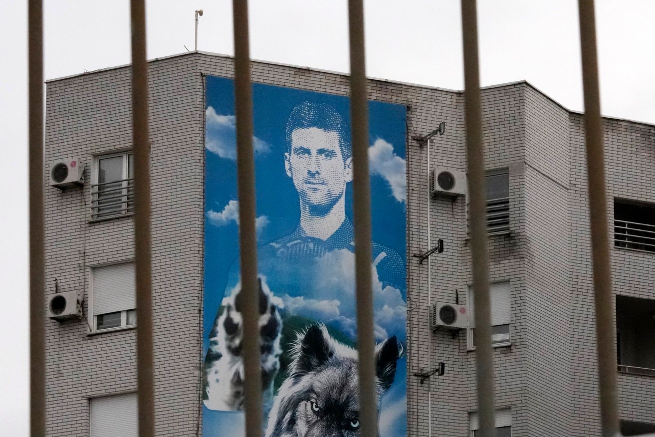 A billboard depicting Serbian tennis player Novak Djokovic on a building in Belgrade, Serbia, Thursday, Jan. 6, 2022. (AP Photo/Darko Vojinovic)