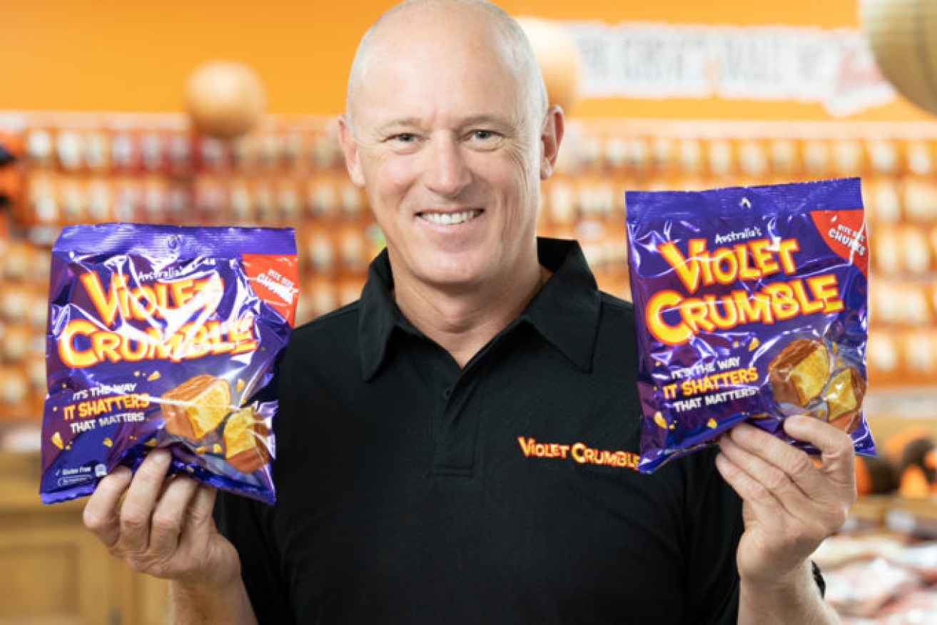 Menz Confectionery CEO Phil Sims with the company's biggest selling product, Violet Crumble.