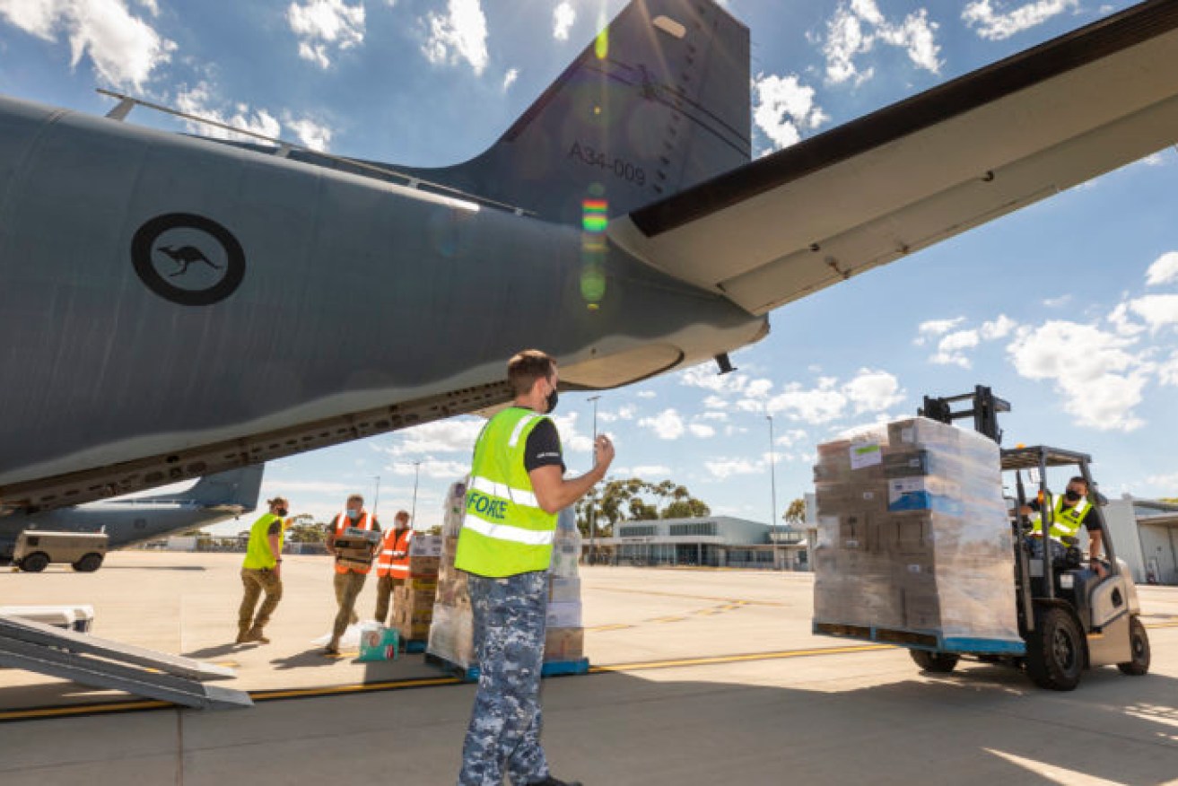 RAAF planes delivered supplies to Coober Pedy after it was cut off by flooding. Photo: AAP/Supplied by Department Of Defence, LAC Stewart Gould