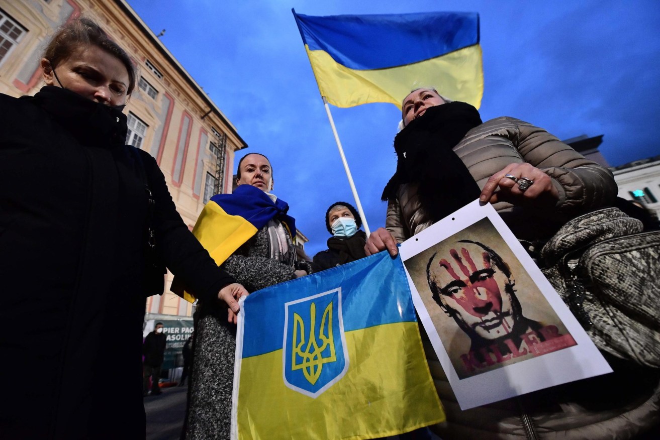 Ukrainian and Italian citizens rally in the streets to say no to the invasion of Ukraine by Russia, in Genoa, Italy. Picture: Luca Zennaro/EPA