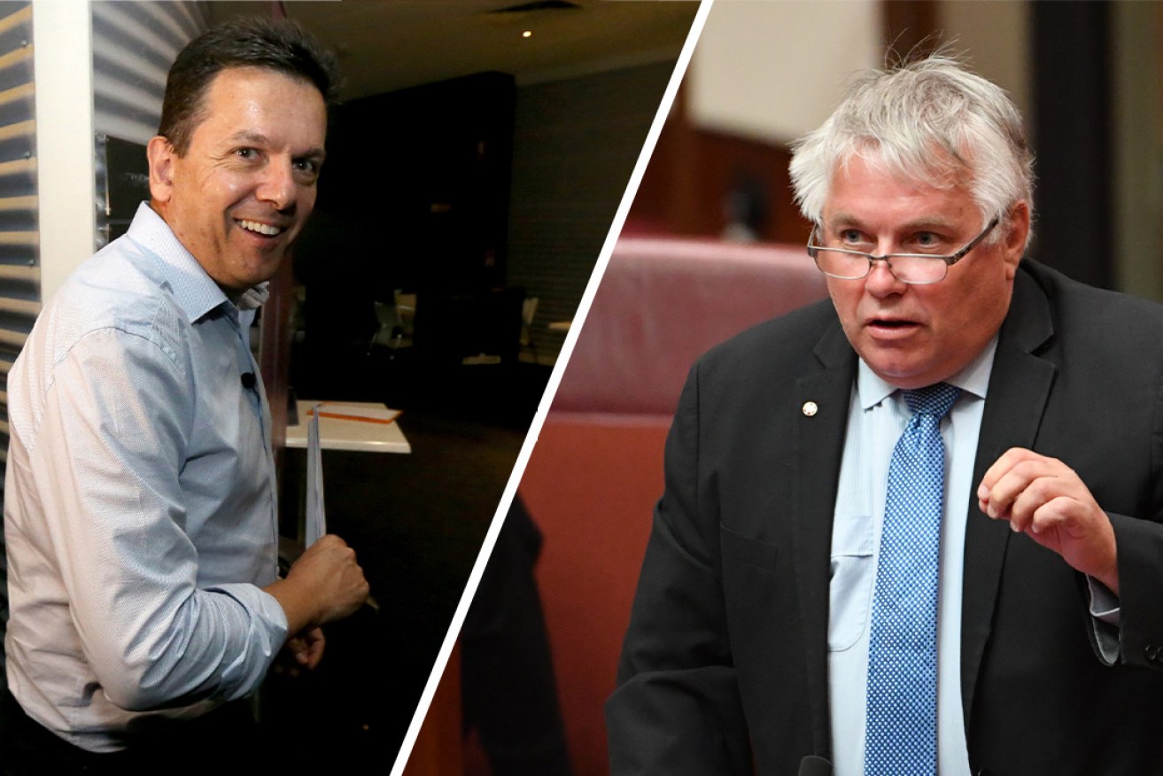 Senator Rex Patrick (right) has savaged challenger and former boss Nick Xenophon over his paid work for Huawei. Photos: AAP