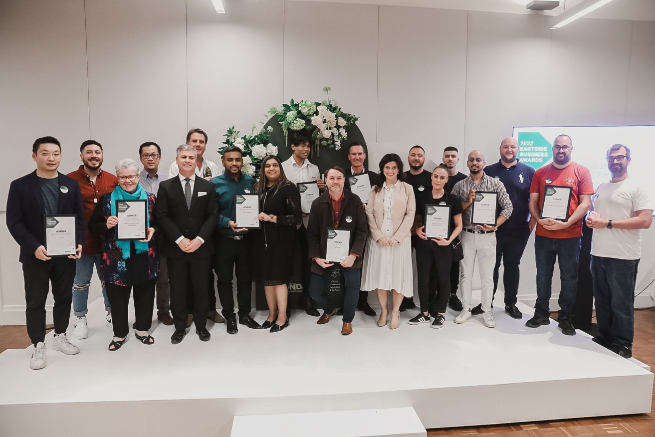 The winners of the 2022 Eastside Business Awards were congratulated by the Minister for Small and Family Business Andrea Michaels (front row, sixth from right) and City of Norwood Payneham & St Peters Mayor Robert Bria (front row, fourth from left).
