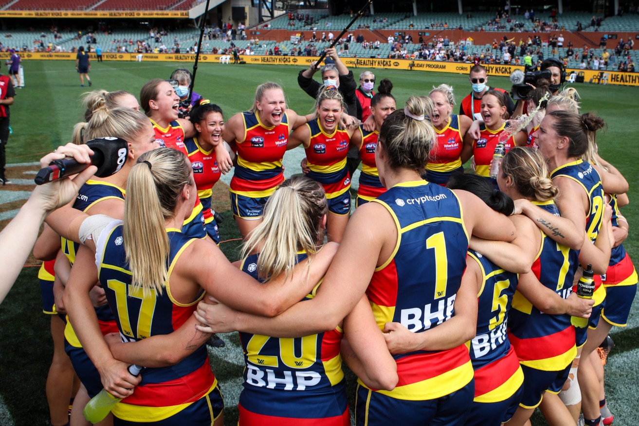 The Crows celebrate their AFLW Preliminary Final win against Fremantle Dockers at Adelaide Oval on April 2. Photo: AAP/Matt Turner