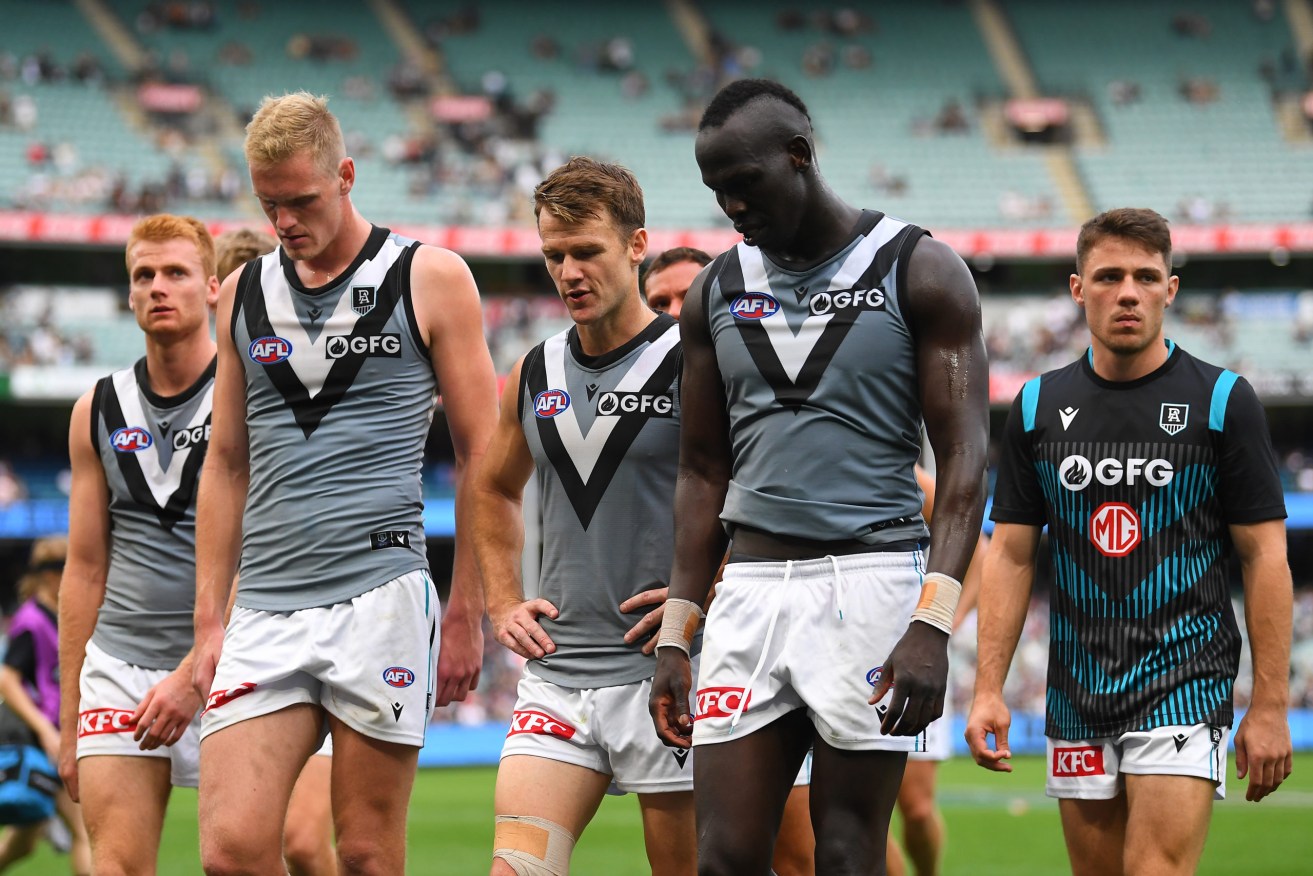 Port Adelaide players after losing to Carlton on Sunday. Photo: AAP/James Ross