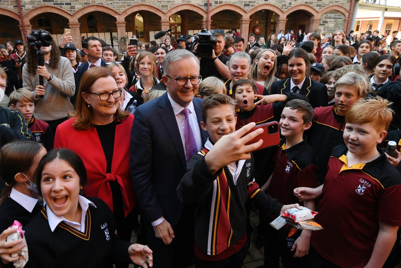Australian Opposition Leader Anthony Albanese takes selfies with students during a visit to Cabra Dominican College in Adelaide. Picture: Lukas Coch/AAP