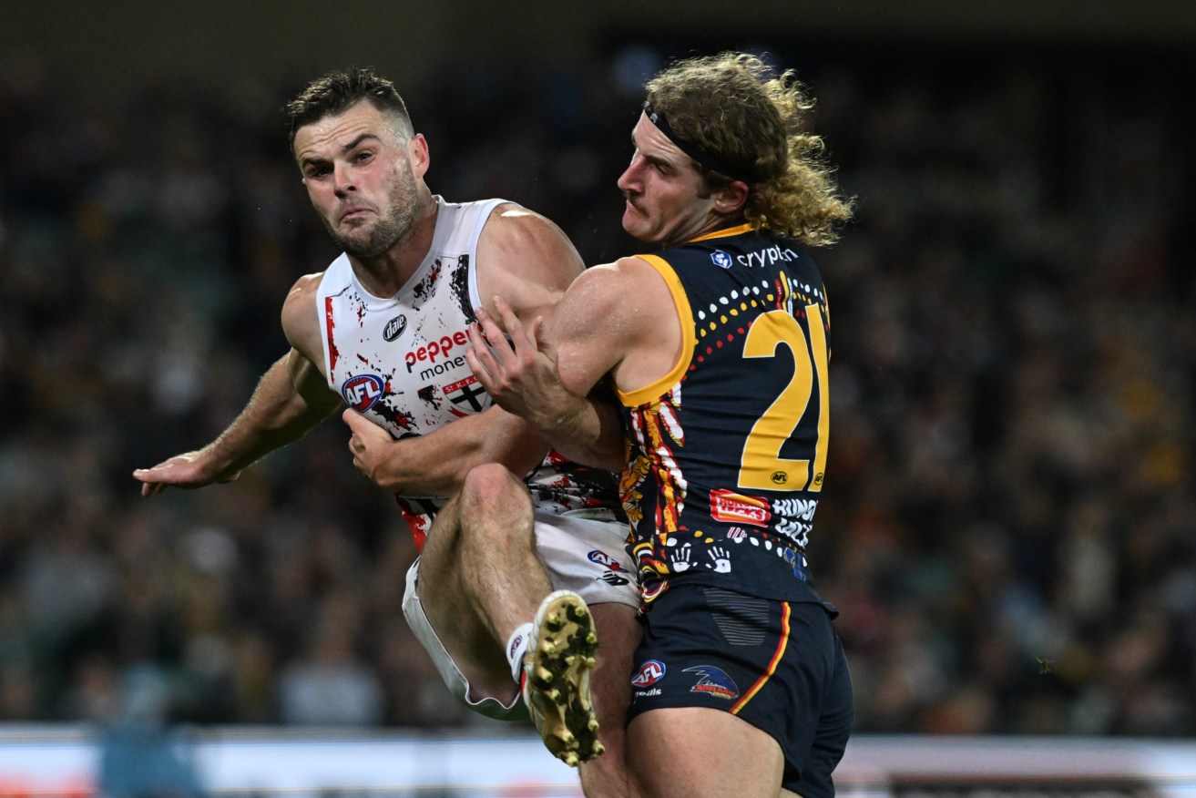 The past meets the future, as Sam Berry tackles the guy whose departure gave Adelaide the draft pick with which they selected him. Crouch got the points this time. Photo: Michael Errey / InDaily