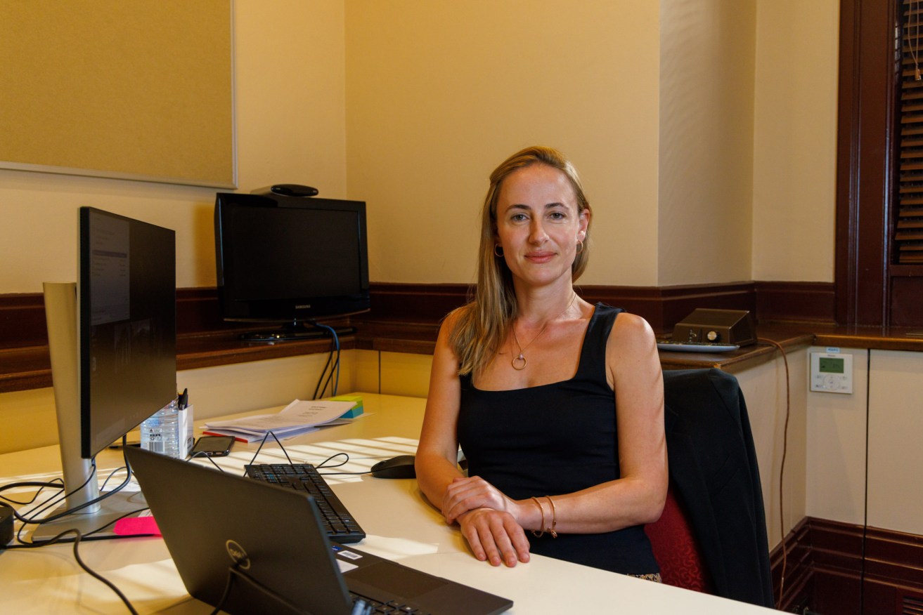 Feet under the desk: One Nation's first SA MLC Sarah Game in her office at Parliament House. Photo: Tony Lewis / InDaily