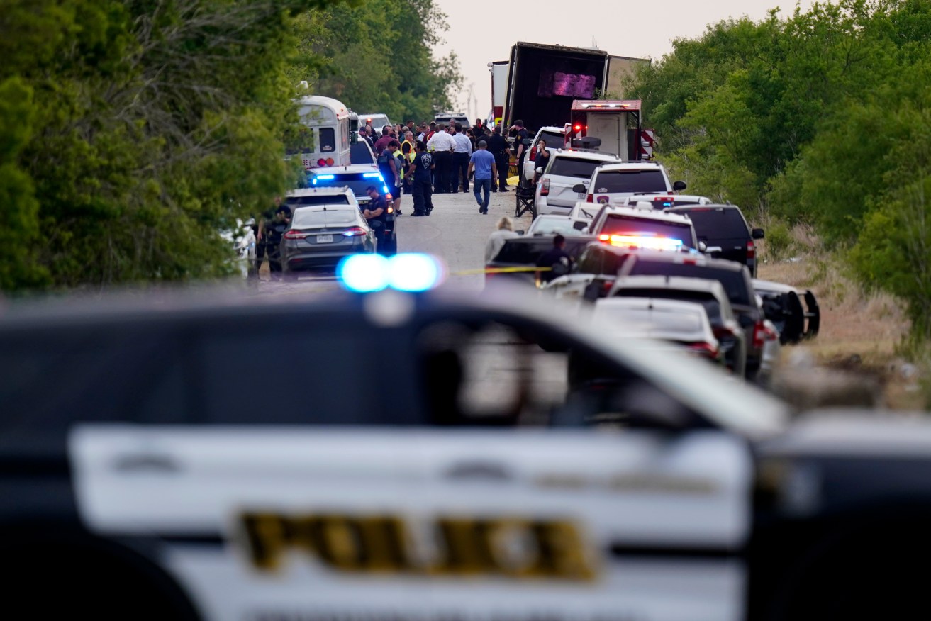 Police block the scene where a tractor trailer with multiple dead bodies was discovered, Monday, June 27, 2022, in San Antonio. Photo: Eric Gay/AP 