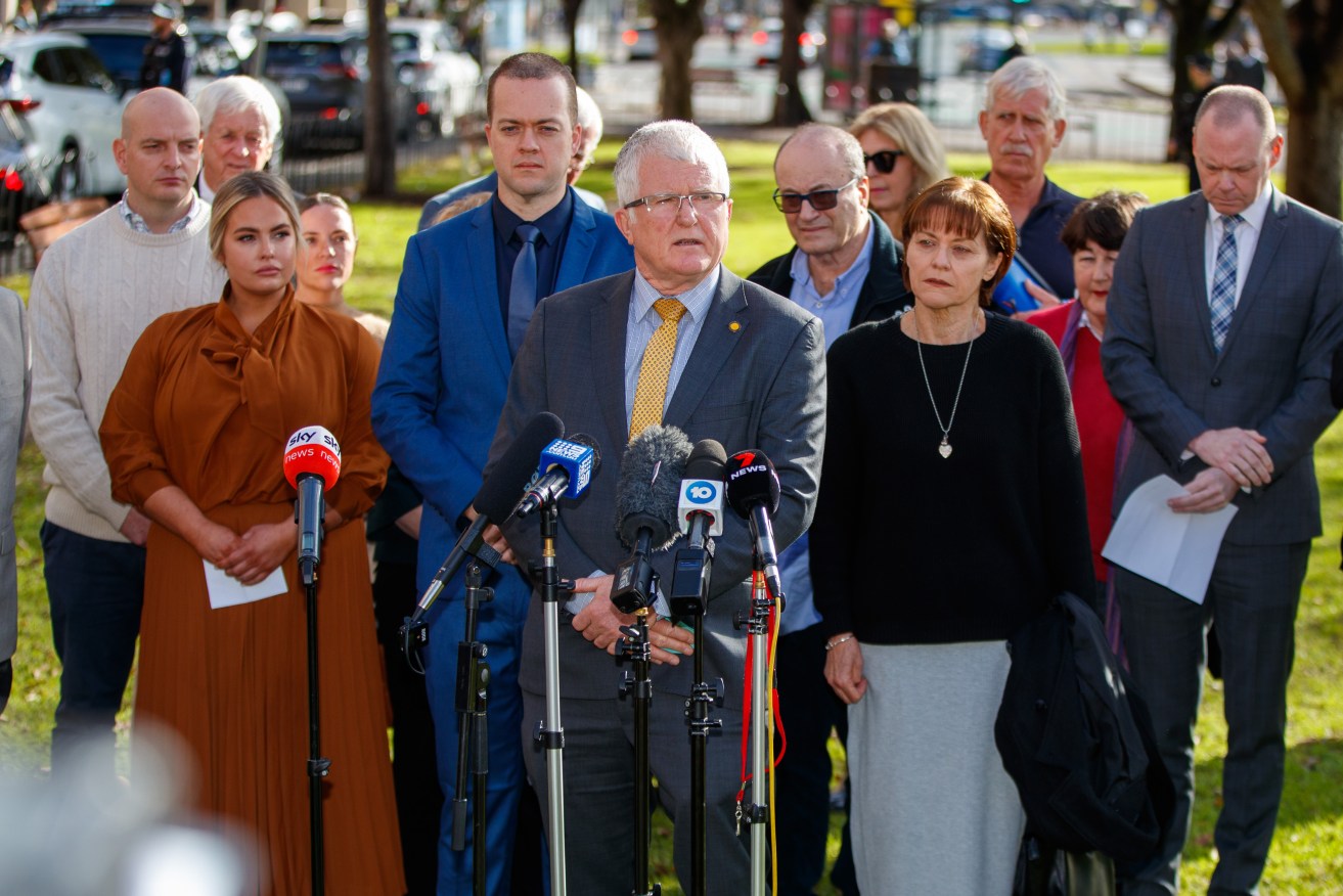 Detective Superintendent Des Bray and family members of Geoffrey Bowen and Peter Wallis at a press conference after the Supreme Court today found Dominic Perre guilty of the 1994 NCA office bombing. Photo: Matt Turner / AAP