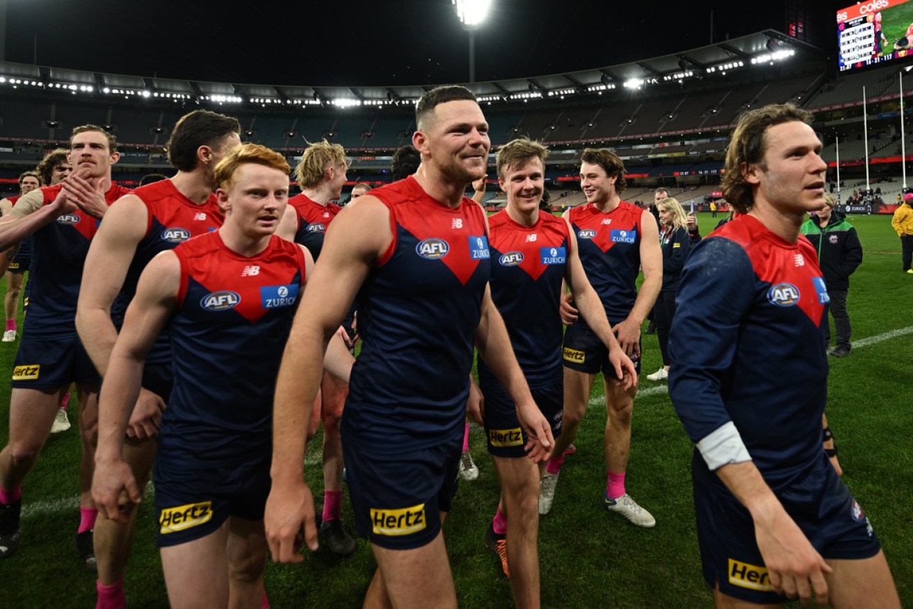Melbourne has reclaimed top spot on the AFL ladder with a dominant win over Brisbane at the MCG. Photo: Joel Carrett/AAP