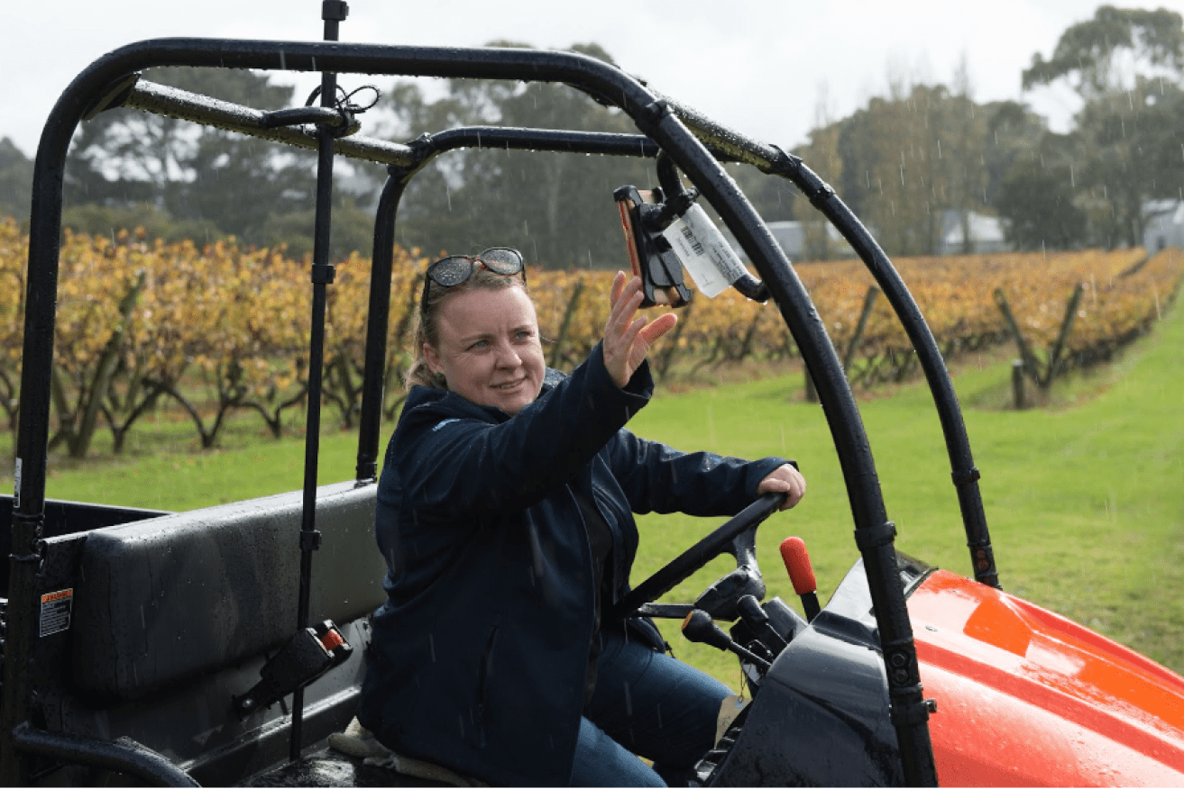 CEO and Co-founder of Platfarm Lydnsey Jackson using the AgTech app in the vineyard. Photo: Supplied. 