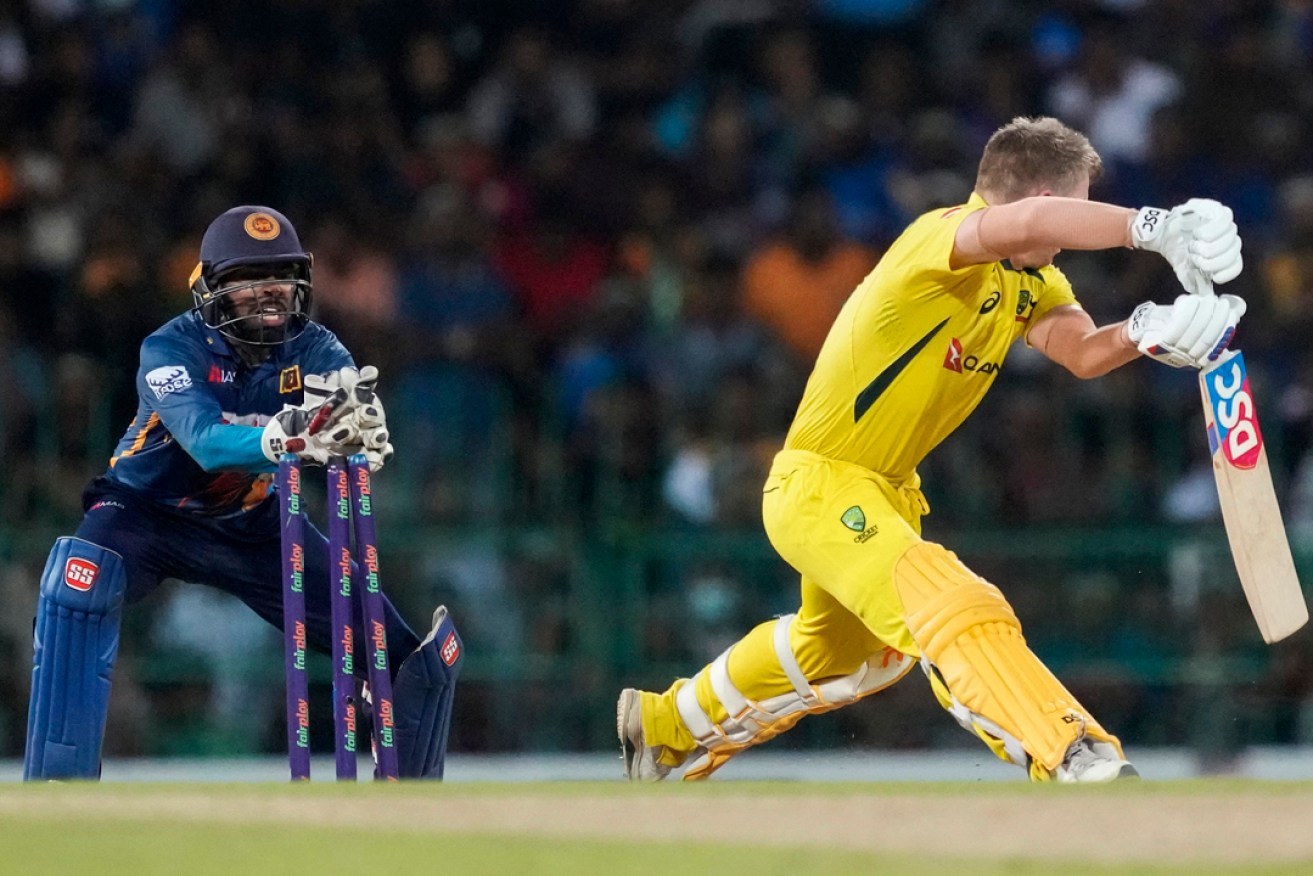 Australia's David Warner is stumped for 99 in his side's narrow loss to Sri Lanka in Colombo. Photo: Eranga Jayawardena/AP