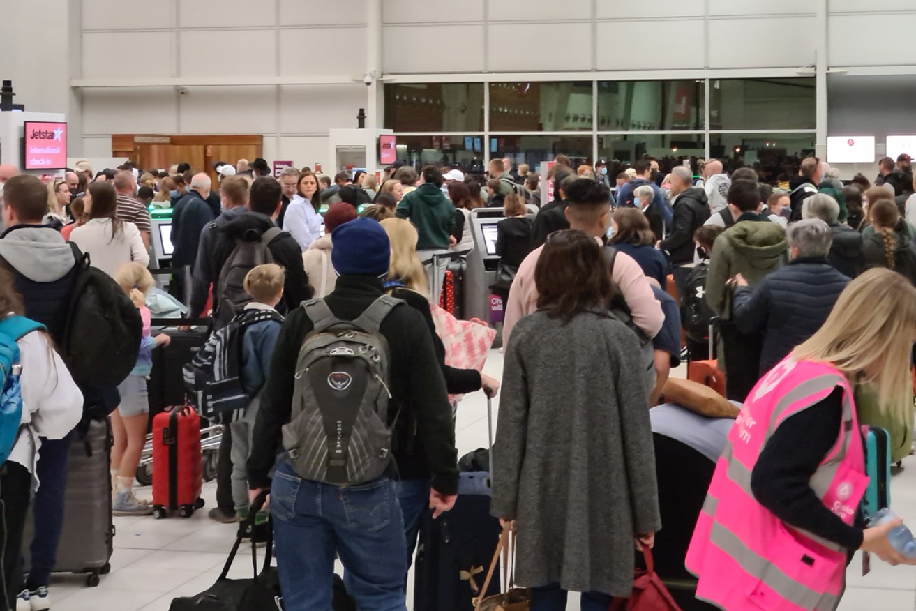 People queue for early morning flights on Friday, July 8, 2022, Adelaide Airport's busiest day since the coronavirus pandemic. Photo: Andrew Spence