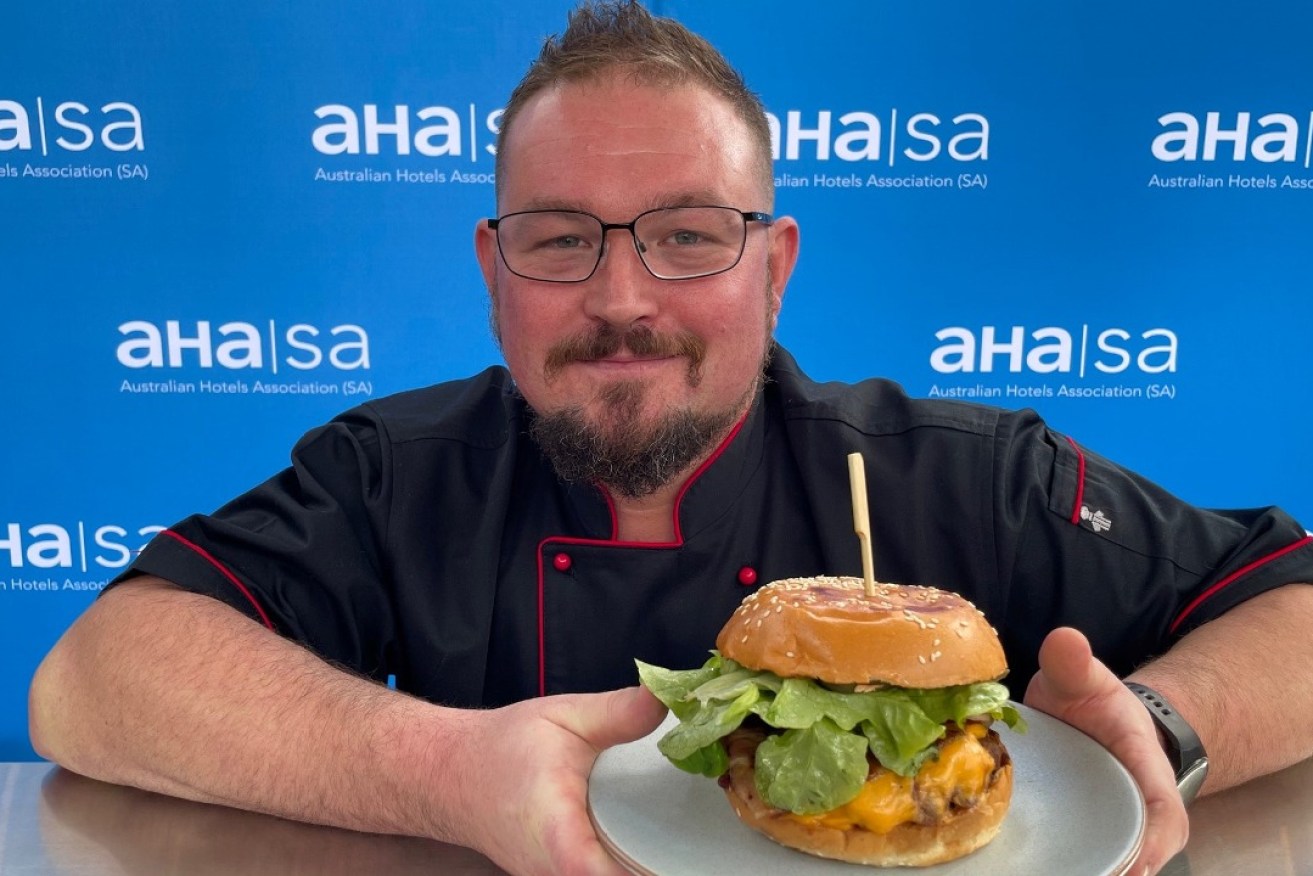 Head Chef Brett Tilley of the Aldinga Hotel with his winning burger. Photo: AHA/SA