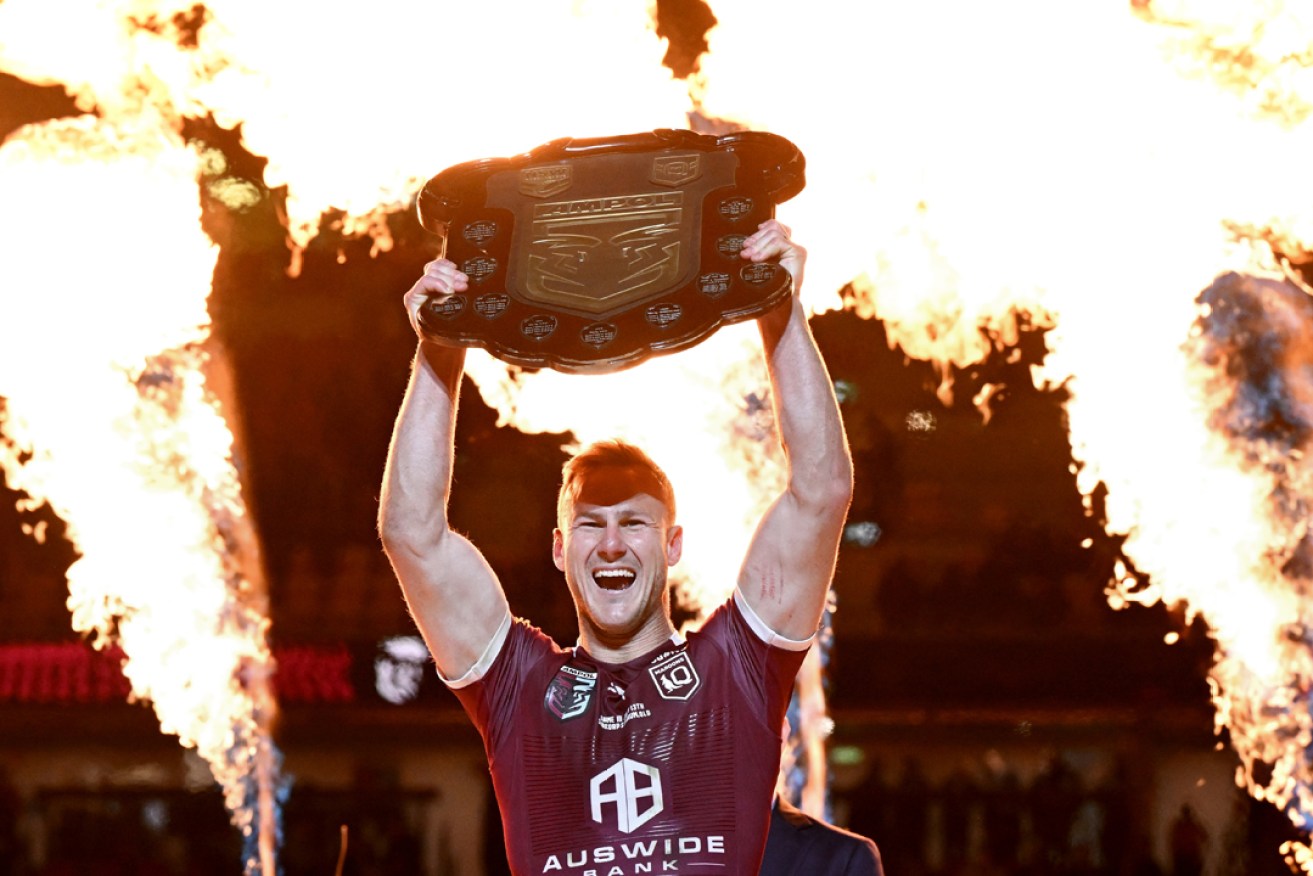 Daly Cherry-Evans of the Queensland Maroons  celebrates winning with the State of  Origin series between the New South Wales Blues at Suncorp Stadium in Brisbane.
Photo: Darren England/AAP