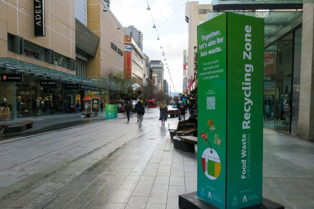 A 'Recycling Zone' bollard promoting the introduction of new green bins in Rundle Mall. 