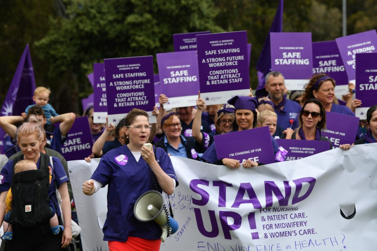 Nurses and their union leader Elizabeth Dabars at a rally in 2019. Photo: David Mariuz/AAP Image