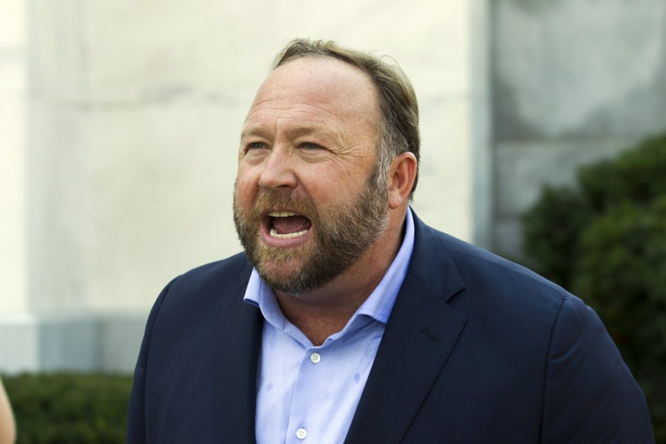 Alex Jones claimed the Sandy Hook school massacre was staged with actors as a conspiracy to introduce gun control. Photo: AP /Jose Luis Magana