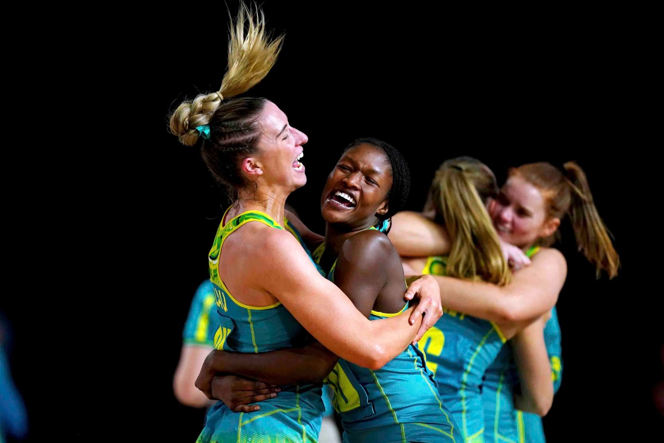 Australia's Sarah Klau, left, and Sunday Aryang celebrate after winning the gold medal match against Jamaica. Photo: Mike Egerton//PA via AP