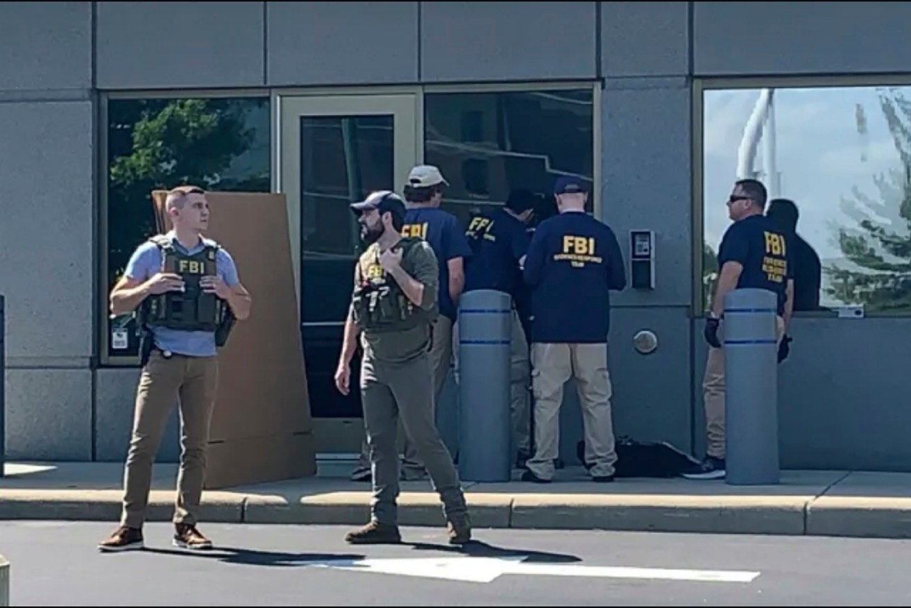 FBI officials outside the Cincinatti office after an armed man attempted to enter. Photo: FOX19 Cincinnati via AP