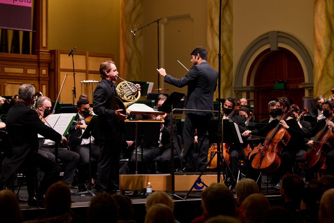 French horn player Andrew Bain with the ASO under the baton of Alpesh Chauhan. Photo: Claudio Raschella