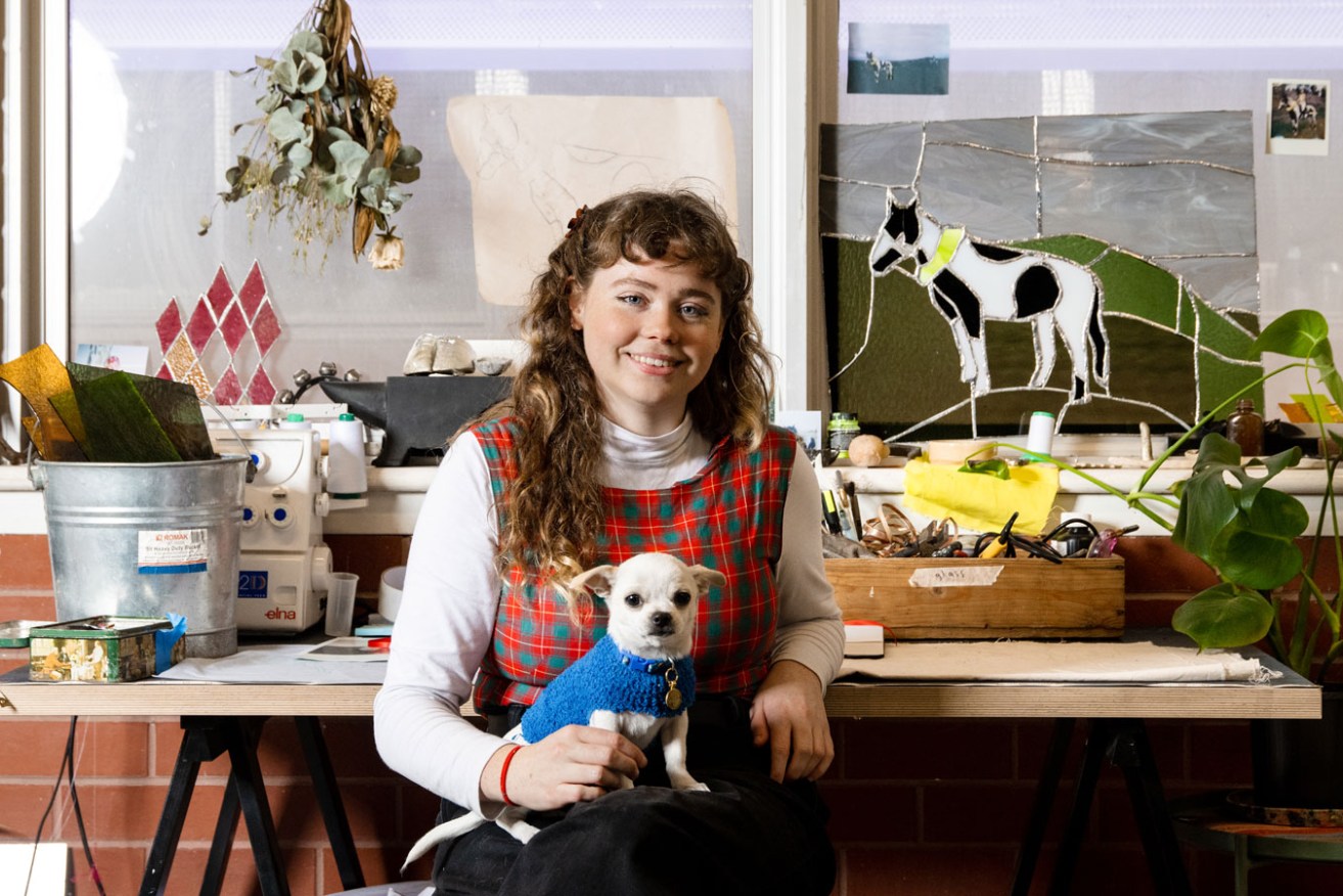 Chelsea Farquhar, pictured with her chihuahua Halloumi, works in ACE Gallery’s upstairs studio space. Photo: Jack Fenby 