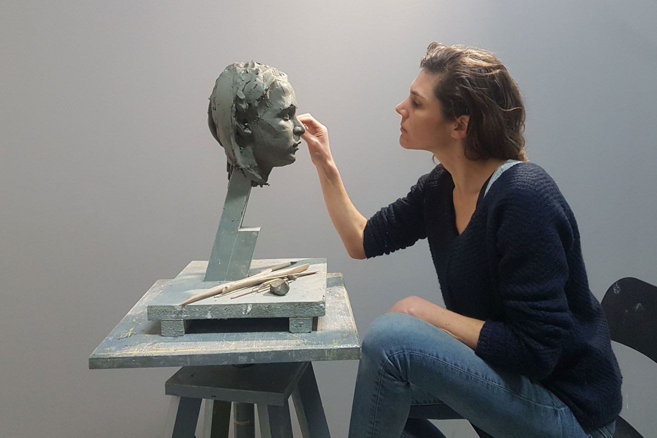 Giorgina Mills sculpting 'Dasha' in 2019, during her fourth year of a residency at the Florence Academy of Art in Italy. Photo: Supplied 