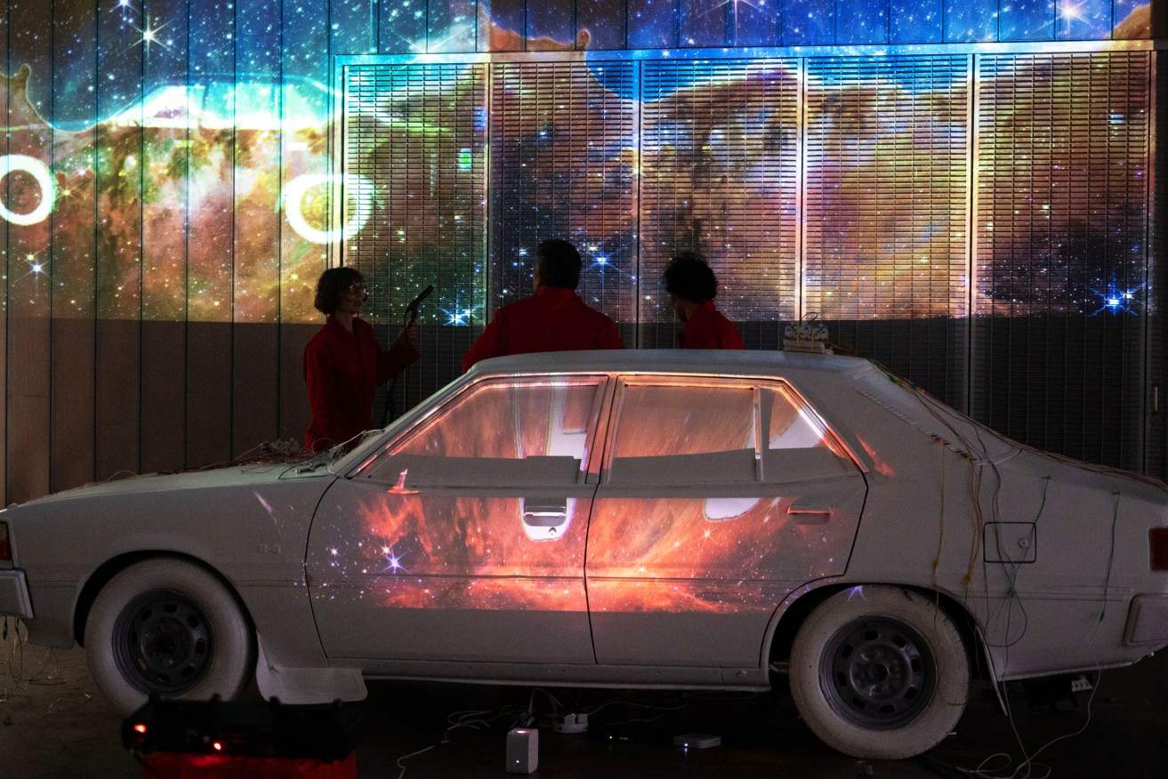 The 'MIDIBISHI' performance at Tonsley features music and projections, all centred on a white-painted 1981 Mitsubishi Sigma. Photos: Kate Zealand