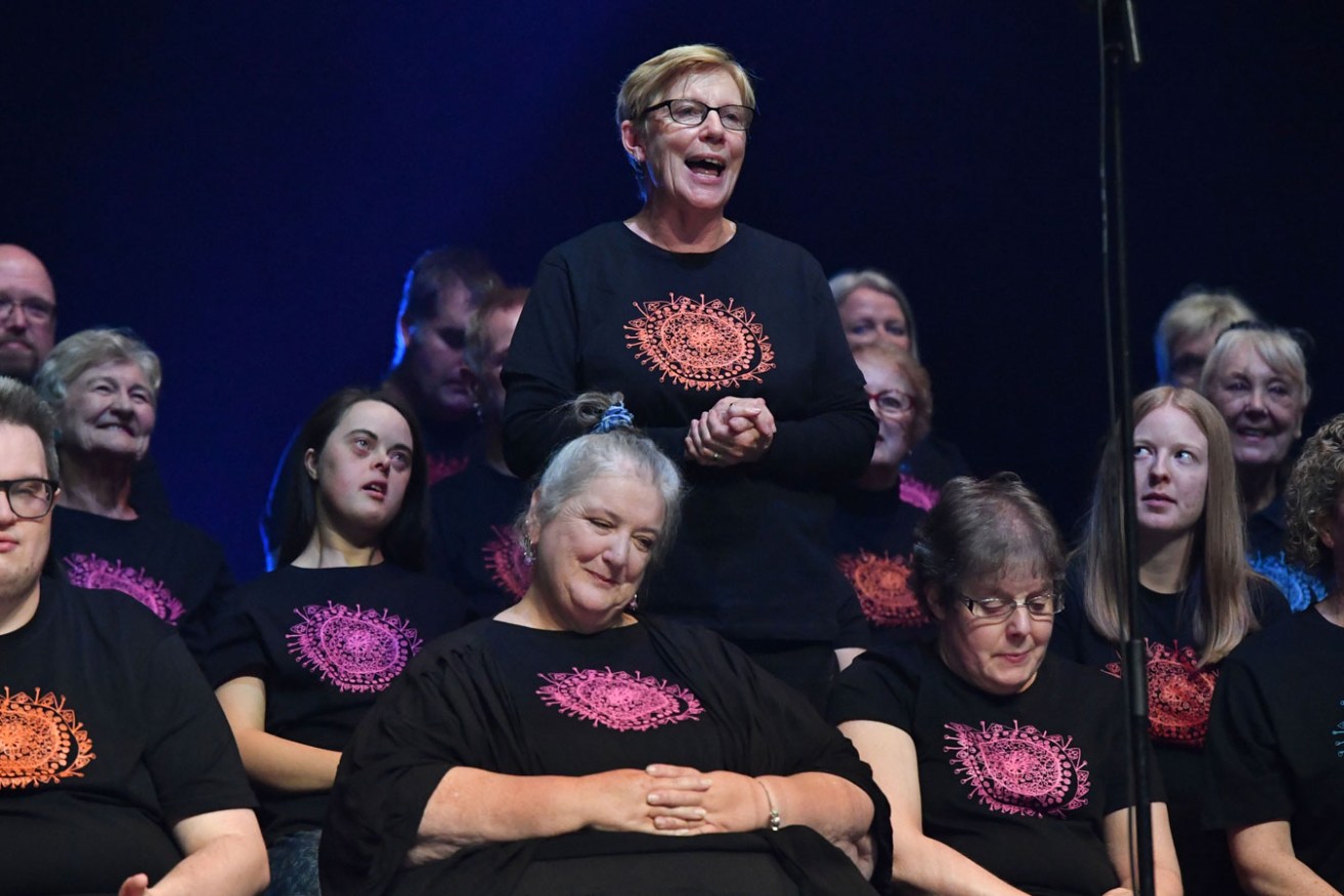 'All voices are welcome': Pat Rix (standing) with the Tutti Choir at the DreamBIG Festival singalong in 2021. Photo: Keryn Stevens 