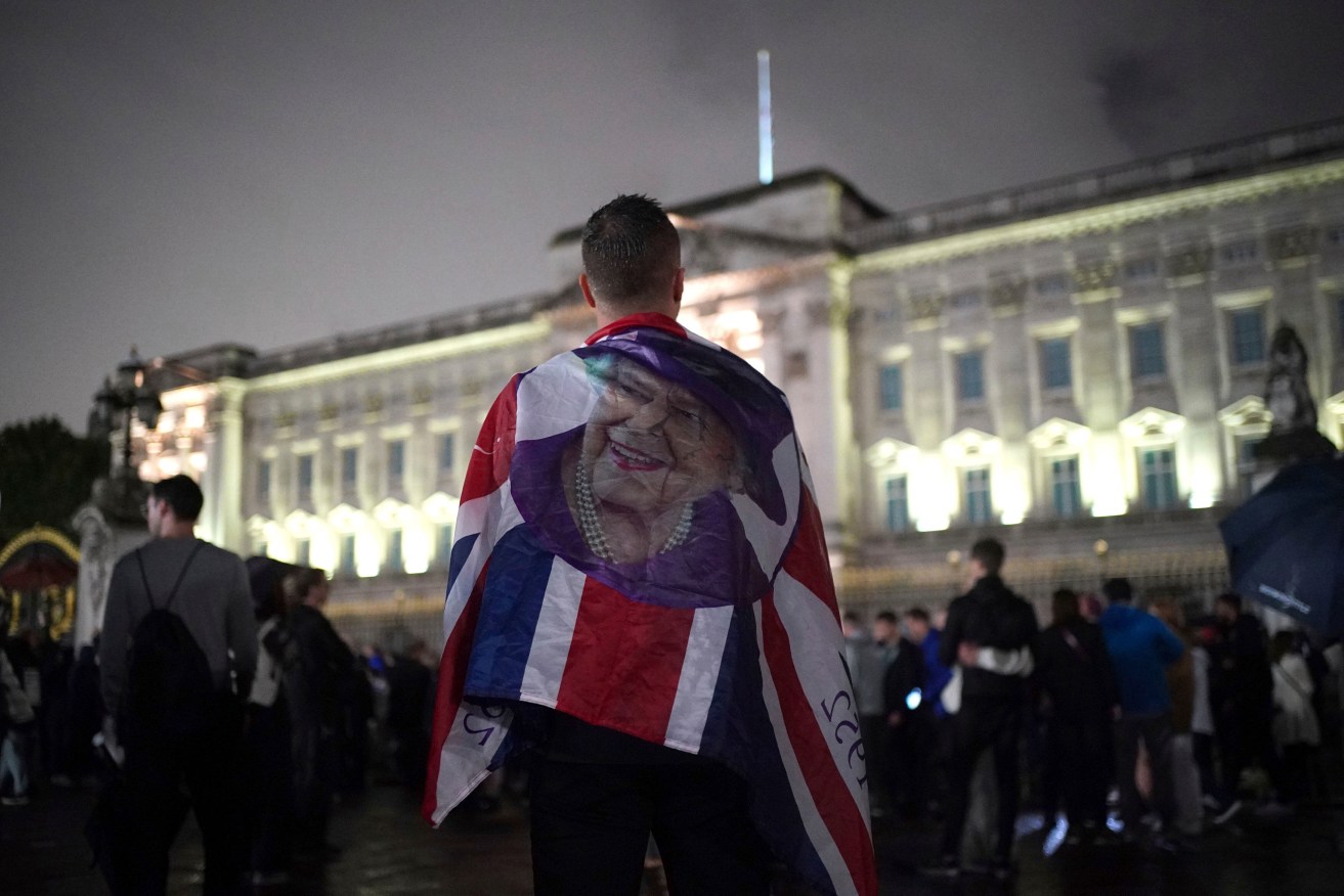 Mourners outside Buckingham Palace following news of the Queen's death. Photo: James Manning/PA via AP