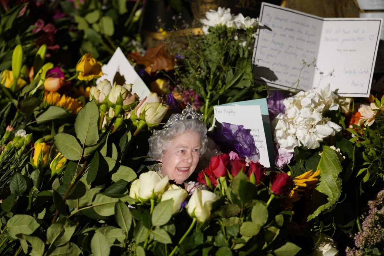 A portrait of Queen Elizabeth II at a memorial near Buckingham Palace. Photo: Markus Schreiber