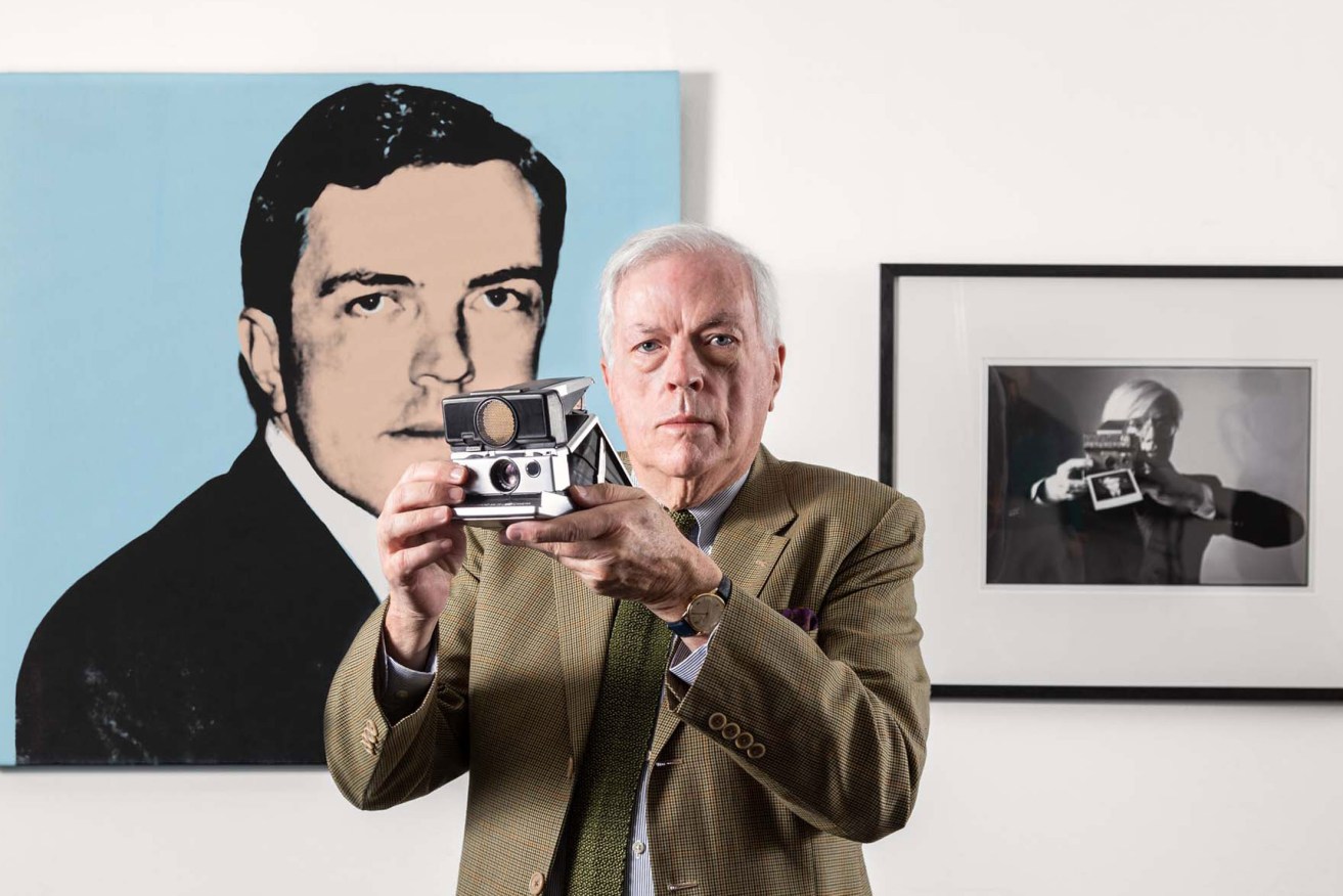 Henry Gillespie with Andy Warhol’s 'Henry Gillespie' portrait and Oliviero Toscani’s 'Andy Warhol', Art Gallery of South Australia. Photo: Saul Steed