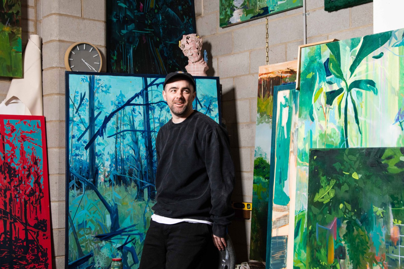 Michael Carney in his warehouse studio space in Kent Town. Photo: Jack Fenby / InReview