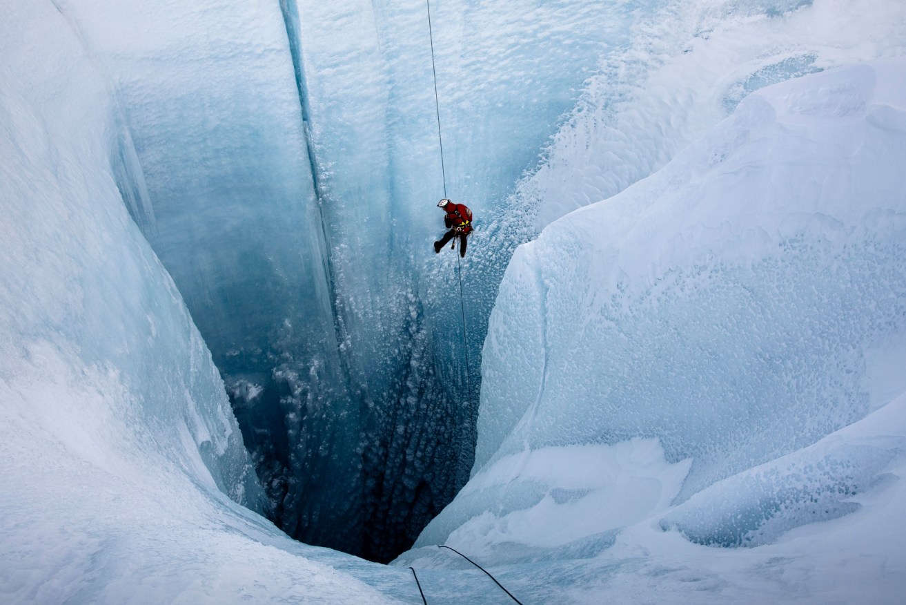 A still from the documentary 'Into the Ice' showing pioneering glaciologist Alun Hubbard on his way into a giant glacier in Greenland. Photo: Lars H Ostenfeld