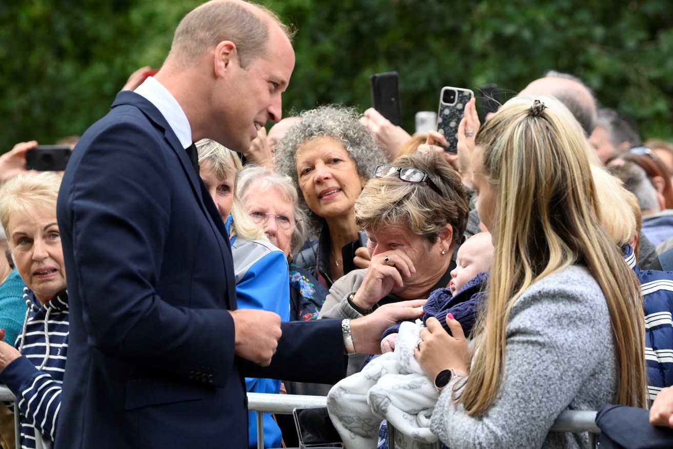 The Prince of Wales meeting wellwishers as he views floral tributes left by members of the public at the gates of Sandringham House in Norfolk. Photo: Toby Melville/PA Wire