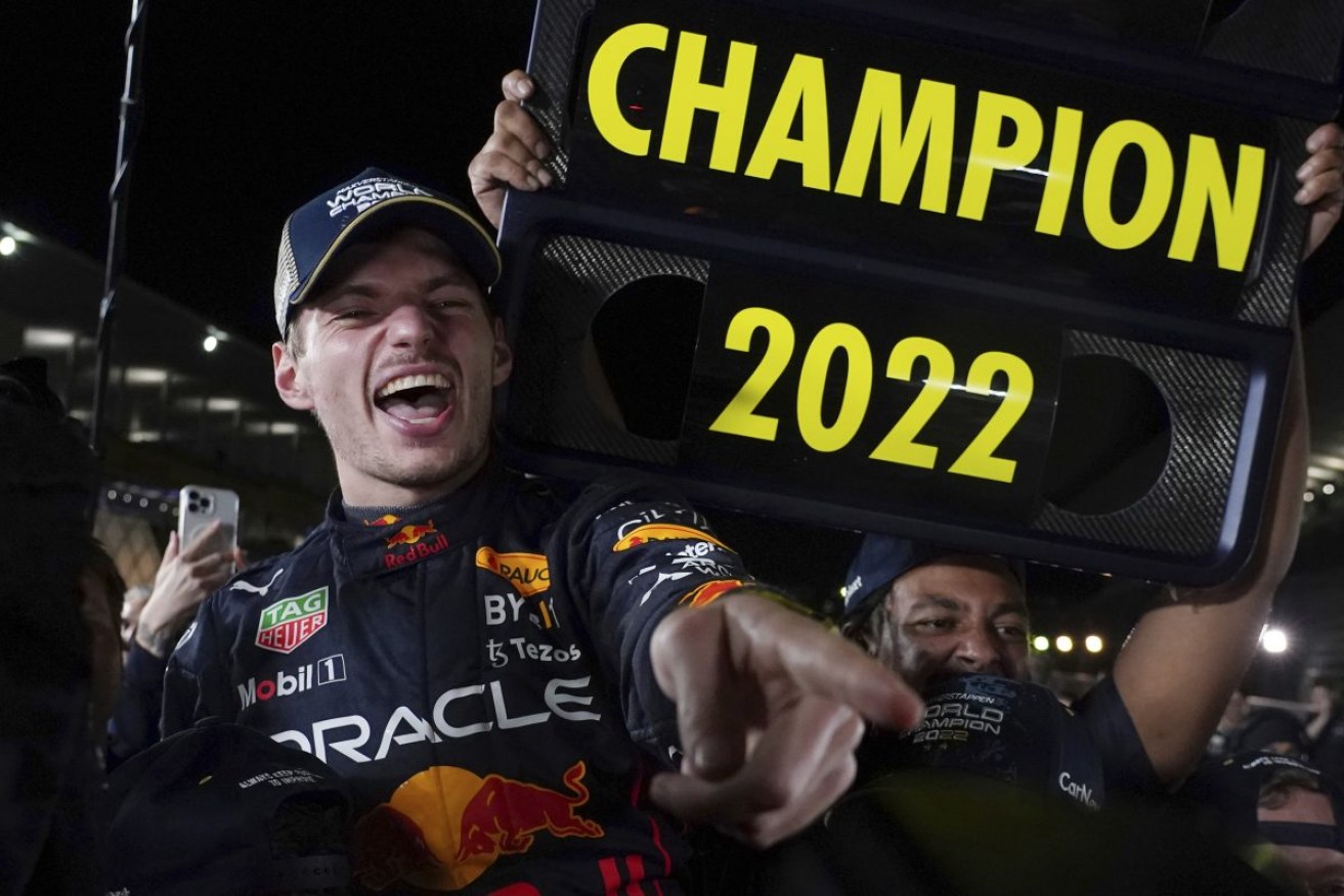 Red Bull driver Max Verstappen celebrates with teammates as he became F1 drivers world champion, during the Japanese Formula One Grand Prix in Suzuka. Photo: AP/Toru Hanai