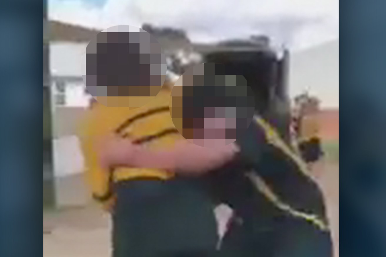 A still image from a videoed fight at an Adelaide school in 2020, one SA principal says behaviour has improved since full-time security staff and new programs were introduced at his school.