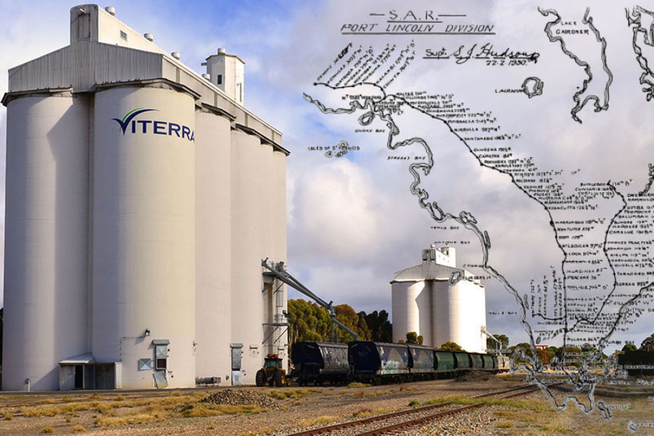 A Viterra grain silo, with 1950 map of active railway lines on Eyre Peninsula. Photo: South Australian Transport Action Group/Viterra