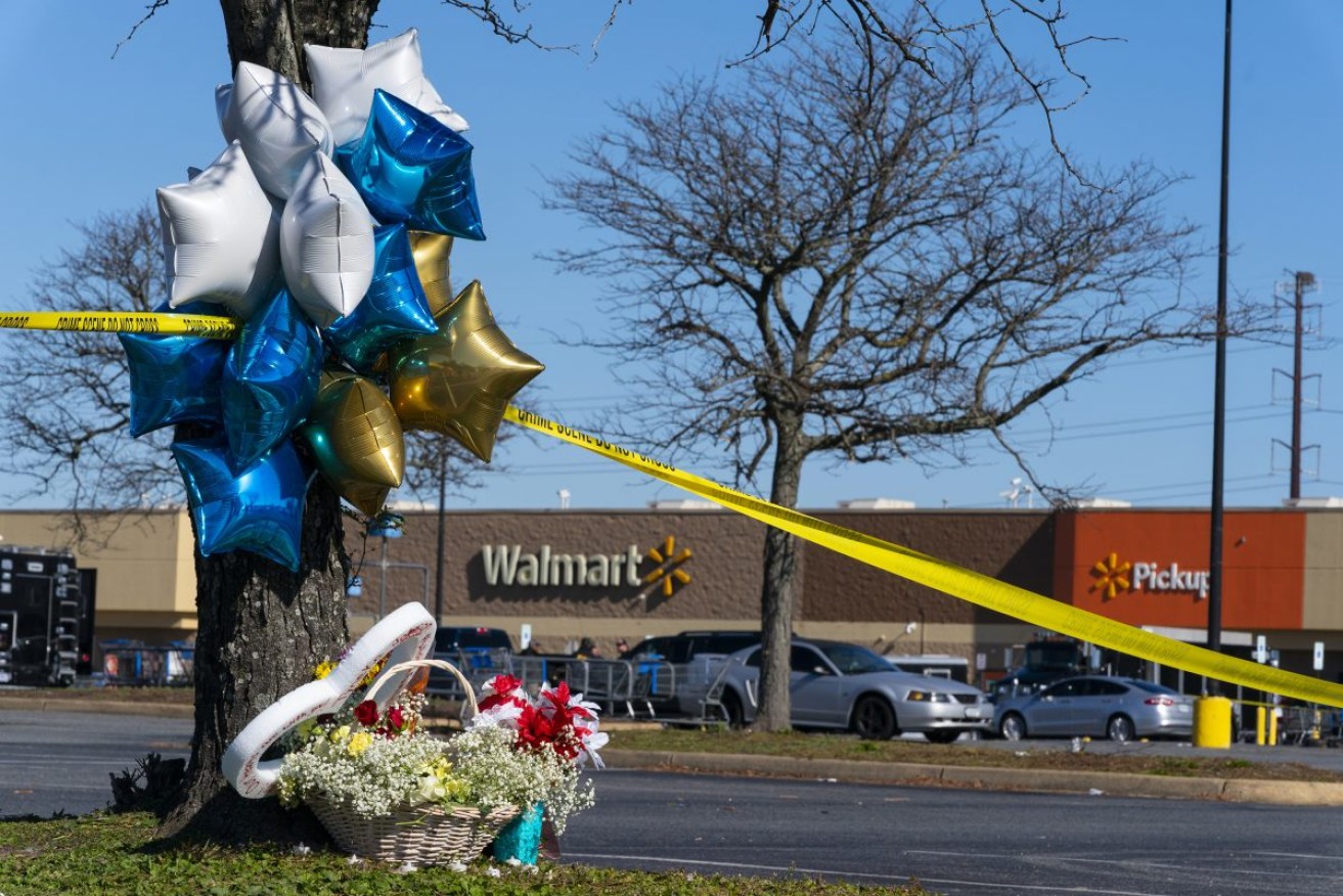 Flowers and balloons have been placed near the scene of a mass shooting at a Walmart, in Chesapeake, Virginia. Photo: AP/Alex Brandon