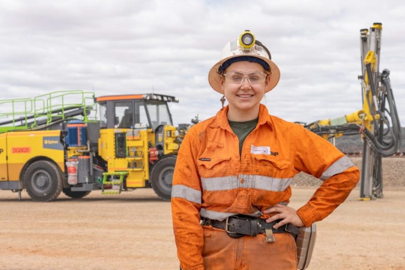 Trainee operator Emily Coutts with the electric jumbo drill at BHP's Olympic Dam mine . Photo: BHP