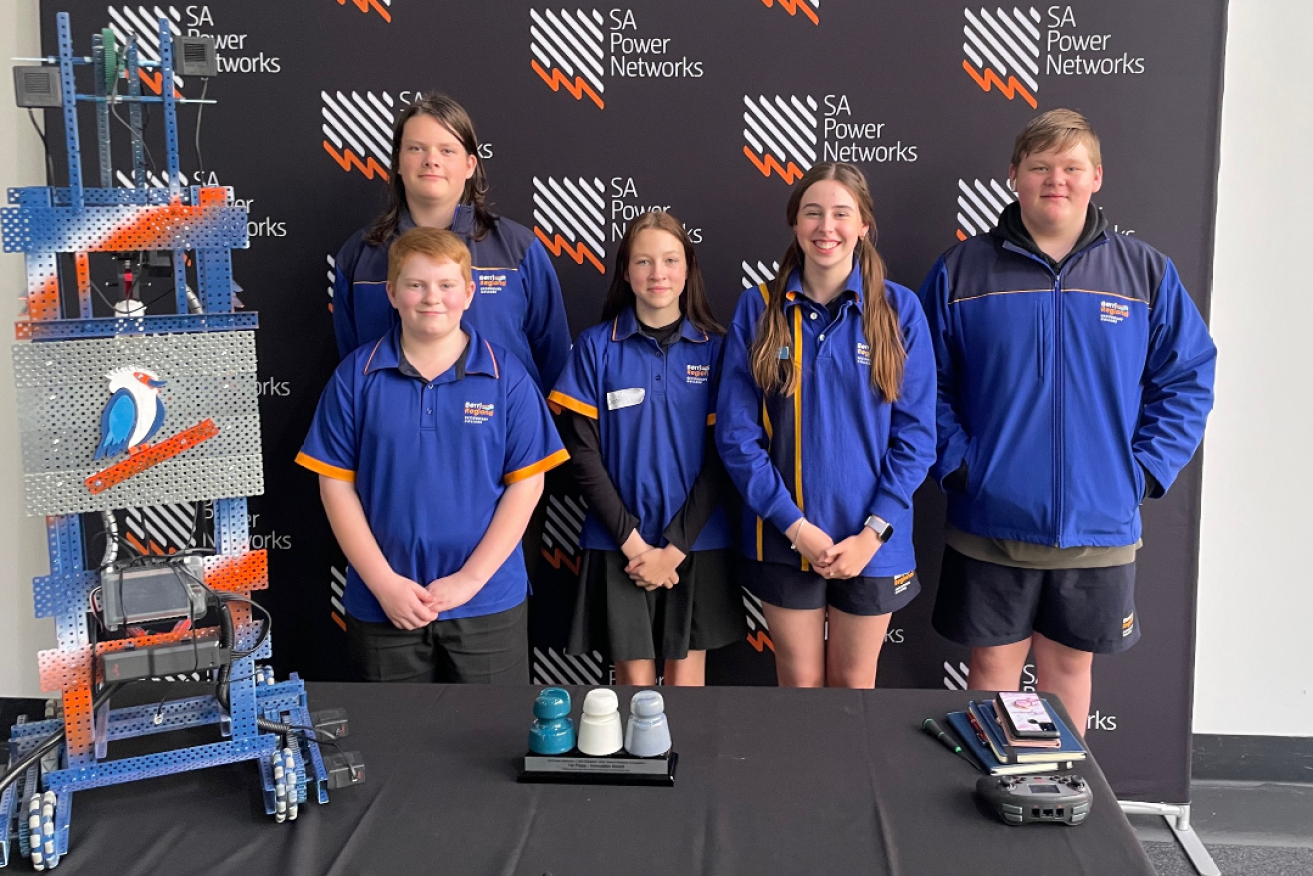 The team from Berri Regional School won the main Innovation Award for their solution. Pictured at the Adelaide Convention Centre with their robot are Berri students Damon Clews (behind), Ethan Baldock, Deni Clark, Kiana Rundell and Josh King. They were accompanied by teacher Tahlia King (not pictured).