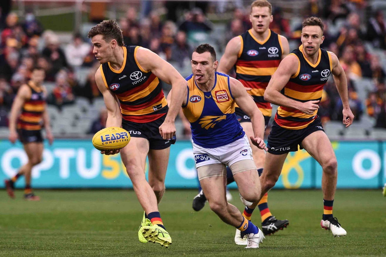 Paul Seedsman (left) in action for the Crows. Photo: Michael Errey/InDaily
