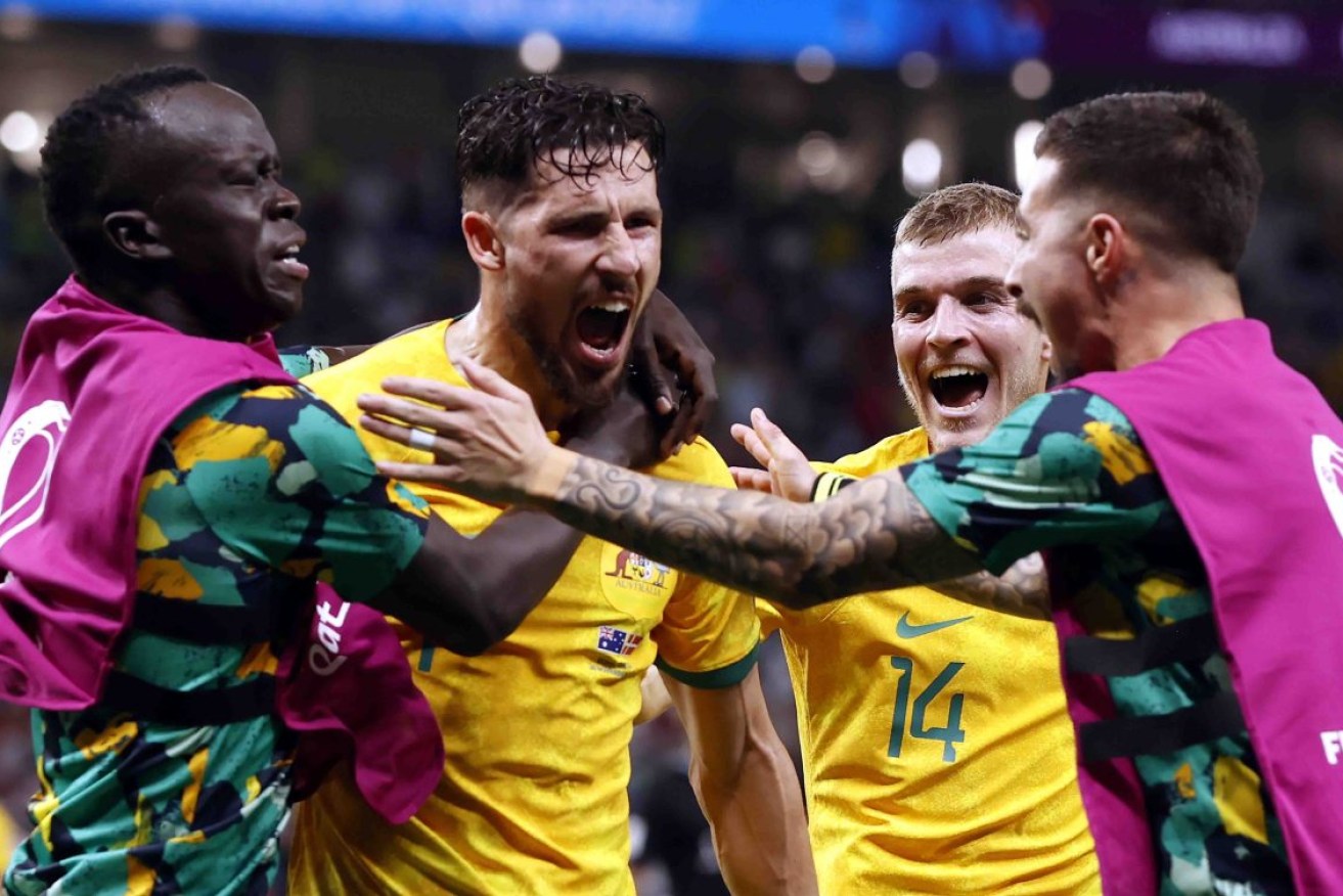 Mathew Leckie celebrates with teammates after his stunning goal against Denmark. Photo: EPA/Rolex dela Pena