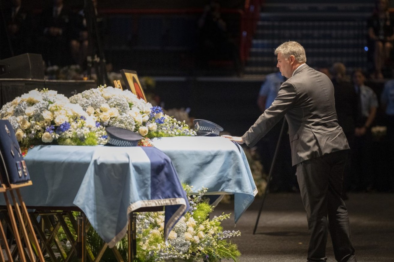 The caskets of Constable Rachel McCrow and Constable Matthew Arnold during the memorial service for the two police constables killed in the Wieambilla shooting tragedy. Photo: AAP Image/Supplied by Queensland Police 