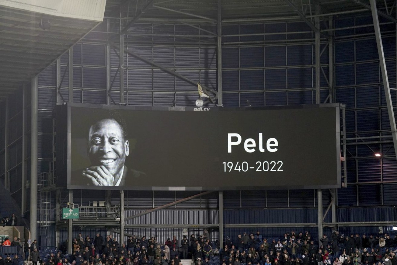 The death of soccer legend Pele is announced before the English Championship soccer match between West Bromwich Albion and Preston North End on Thursday. Photo: Joe Giddens/PA via AP