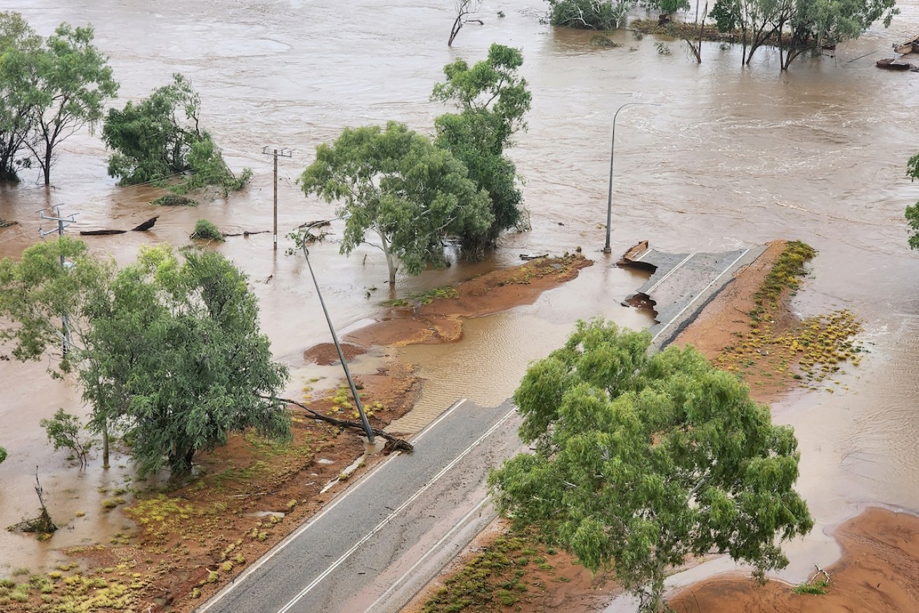 Floodwaters across the Great Northern Highway and the Fitzroy Crossing Bridge in the Kimberley region of Western Australia. Photo: AAP/Supplied by Department of Fire and Emergency Services WA
