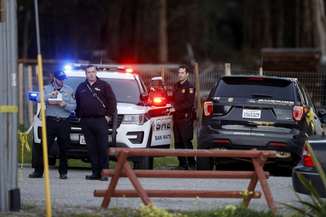 Police gather along a road near where seven people were found shot to death in Half Moon Bay, California. Photo: Carlos Gonzalez/San Francisco Chronicle via AP